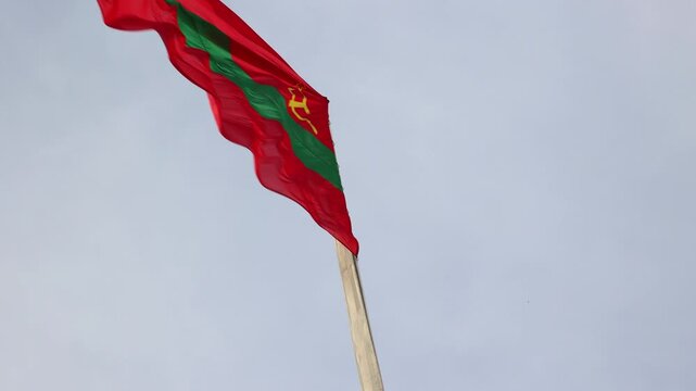 Transnistria flag waving against a cloudy sky
