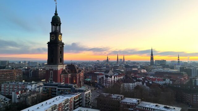 Aerial drone video (forward flight) of the famous St. Michaelis Church at sunrise in Hamburg