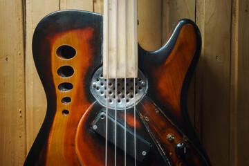 Vintage design of an old four-string bass guitar