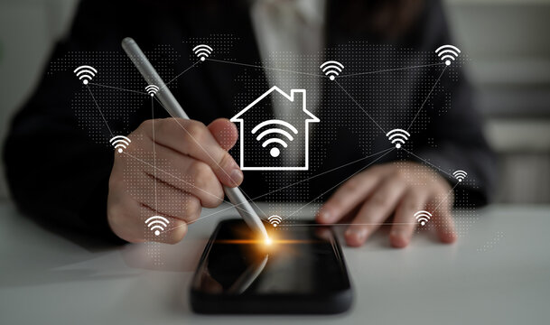 A business professional interacts with a smartphone, exploring smart home technology and Wi-Fi connectivity, highlighting digital lifestyle and modern automation solutions. Gantry - Powered by Adobe