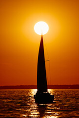 Sailing regatta in the Gulf of Finland at sunset, few sailing yachts competing in a race, splashing...