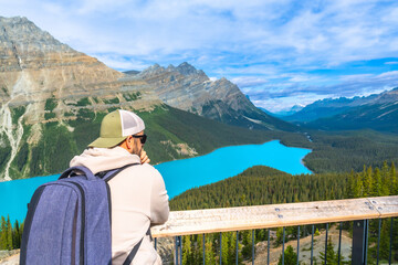 Tourist admiring peyto lake panoramic view in banff national park