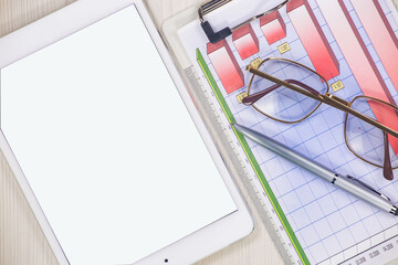 Business and accounting supplies arranged in a composition on an office desk. Top view.