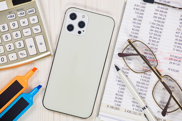 Business and accounting supplies arranged in a composition on an office desk. Top view.