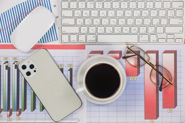 Business and accounting supplies arranged in a composition on an office desk. Top view.