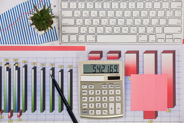 Business and accounting supplies arranged in a composition on an office desk. Top view.