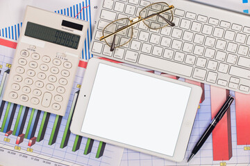 Business and accounting supplies arranged in a composition on an office desk. Top view.