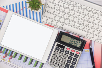Business and accounting supplies arranged in a composition on an office desk. Top view.