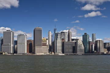 Fototapeta premium Lower Manhattan Skyline taken from Brooklyn partly cloudy day