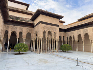 Fototapeta premium Alhambra of Granada, Spain. Intricate architecture with arches and greenery.