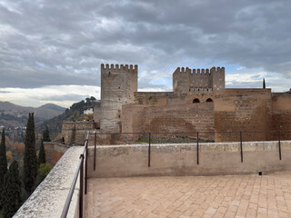 Obraz premium Historic Fortress with Towers Against a Cloudy Sky