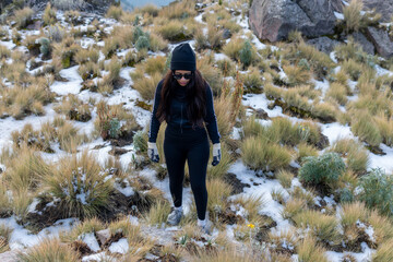 Woman hiking izctaccihuatl volcano snow trail experiencing winter