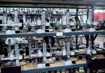 Many 3D printers printing object. 3D printers printing model from molten plastic. 3D printers creating shape from molten plastic flowing out of extruder. New modern 3D Printing additive technologies