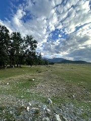 Endless plain stretches under vast sky with distant mountains
