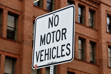 Obraz premium NO MOTOR VEHICLES warning sign indicating restricted access area