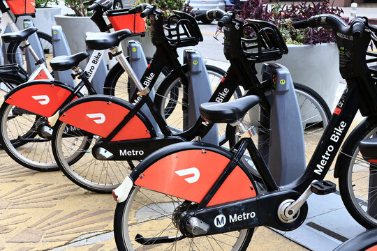 Los Angeles California &ndash; November 4, 2025: Metro Bike bicycles with DoorDash advertising at a public bike sharing station