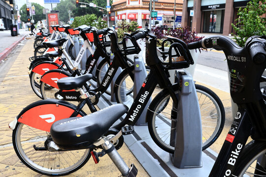 Los Angeles California &ndash; November 4, 2025: Metro Bike bicycles with DoorDash advertising at a public bike sharing station