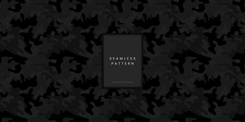 Seamless monochrome camouflage pattern or dynamic camo texture with jagged organic shapes in black and dark grey for modern tactical military gear and rugged outdoor equipment surface © gegen