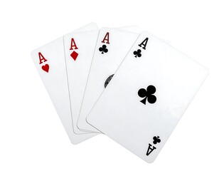 Obraz premium Four playing cards, each showing the Ace symbol, fanned out against a clean white background