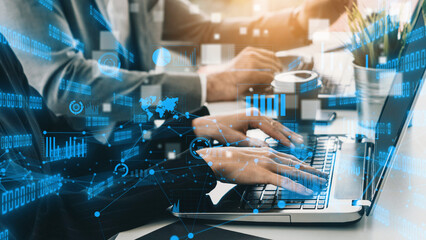 A dynamic scene showcasing business professionals collaborating in a modern office, enhanced by a digital data overlay that represents technology and productivity. Xenic