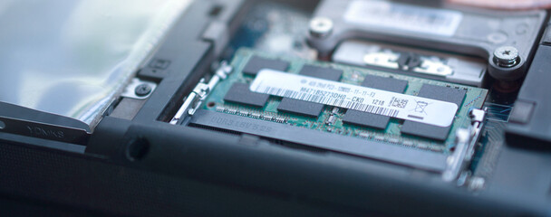 Low angle profile shot of the internal components including RAM and the plastic chassis frame....