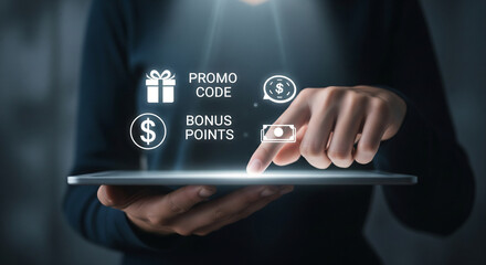 Person uses digital tablet to access online rewards and promotions with glowing icons.