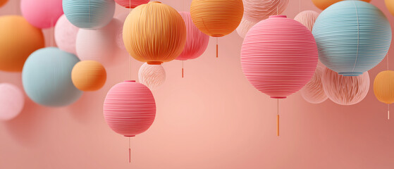 A colorful array of paper lanterns and balloons floating in mid-air against a soft pink background