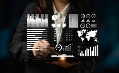 A business professional examines data on a digital tablet featuring various charts and graphs, providing insights for effective marketing and finance strategies. Impute