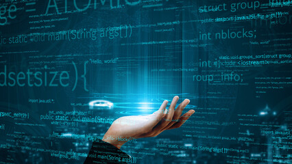 A futuristic hand reaching out to a glowing holographic display showcasing programming code in a digital environment, symbolizing progress and innovation in technology. Xenic