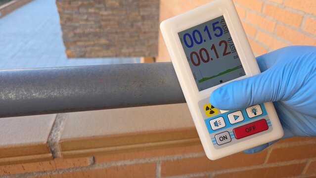 Radiation measurement with geiger counter device in outdoor urban setting for safety assessment
