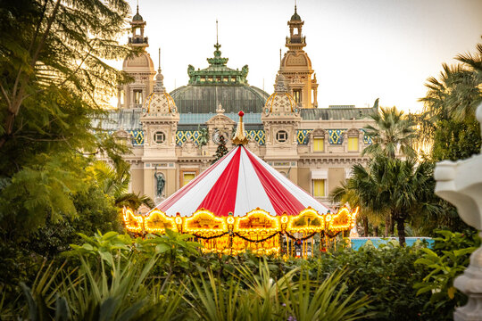 carousel with casino of monaco in background, winter, monaco, monte carlo, luxury, cote d'azur, 