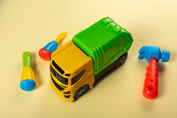 Fototapeta premium Colorful toys on a yellow background