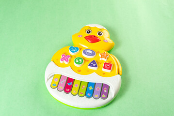 Colorful toys on a green background