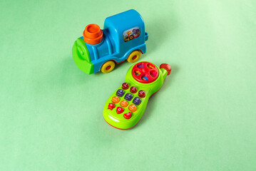 Colorful toys on a green background