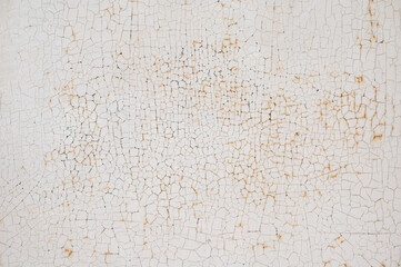 Rusted metal door with peeling off-white paint, creating a rough and distressed surface suitable as an abstract industrial background Iz-Zeytun, Malta, 10 DEC 2025.