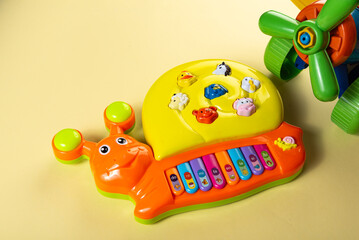 Obraz premium Colorful toys on a yellow background