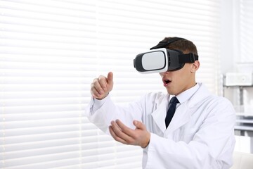 Modern technology. Doctor using virtual reality headset indoors, space for text