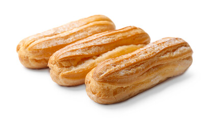 Tasty eclairs with powdered sugar isolated on white