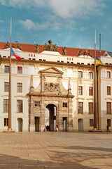 Sunlit Baroque Entrance Scene, Grand Old Palace Entrance Beneath Clear Sky With Solitary Guard Nearby