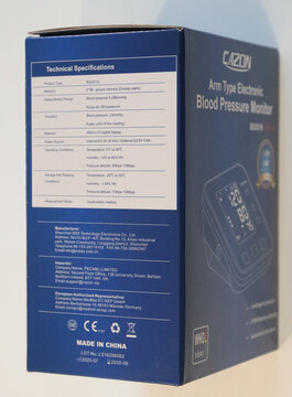 Norwich, england november 26 2025 blue blood pressure monitor box with product details on white background