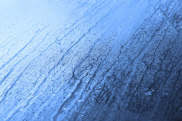 Morning dew on car back window texture background.