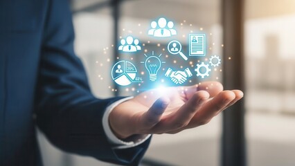 Closeup Businessman Hand holding digital icons of people and team management, representing human resources, recruitment, employee data, business leadership, and digital HR solutions