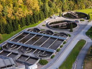 A wastewater treatment facility operates in a smart city utilizing innovative technology for water management and environmental protection.