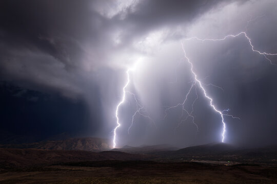 Lightning bolt strike illuminates the sky in a storm