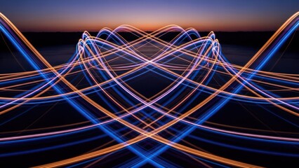 Abstract symmetrical light trails in blue, orange, and purple hues against a dark dusk