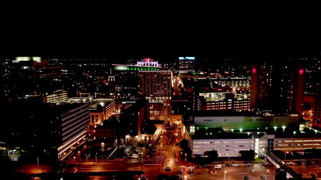 Norfolk skyline by night with slow camera lift up. Norfolk is the second-most populous city in Virginia and the host of the largest navy base in the world