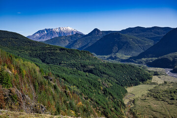 2023-10-18 MOUNT SAINT HELENS WITH A SNOW CAP AND SURROUNDING VEGATATION WITH A NICE SKY IN THE STATE OF WASHINGTON
