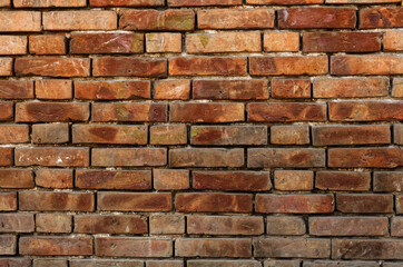 Fototapeta premium Rustic Brick Wall Texture: Weathered Red Brick Pattern with Age Marks and Rustic Details for Vintage Architecture Design Inspiration