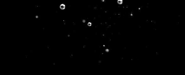 Close up shot of water particles movement in the transparent glass © taffpixture