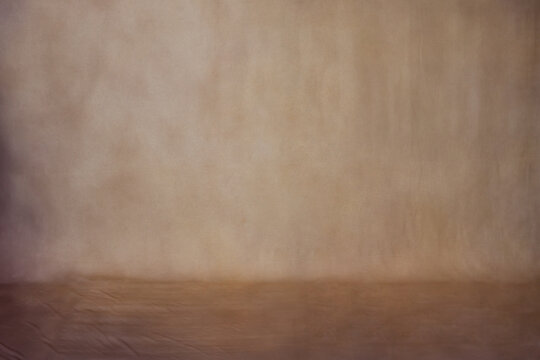 Professional dark brown muslin backdrop with a subtle textured finish. Perfect for portrait photography, product shoots, and studio video background setups